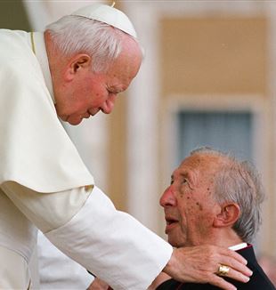 Saint Pope John Paul II greets Msgr. Luigi Giussani at a gathering of ecclesial movements at the Vatican in 1998
