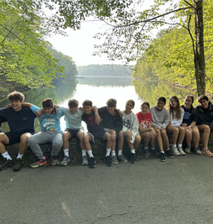 High school and Middle school aged children on an early morning hike on the last day of the Lower Midwest family vacation 