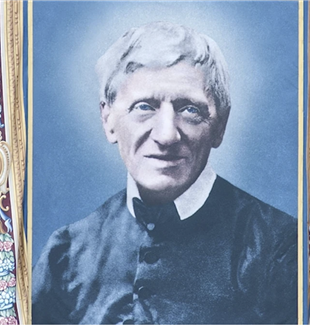 The tapestry with Newman's face on the facade of St. Peter's Basilica on the day of his canonization, October 10, 2019 (©Catholic Press Photo)